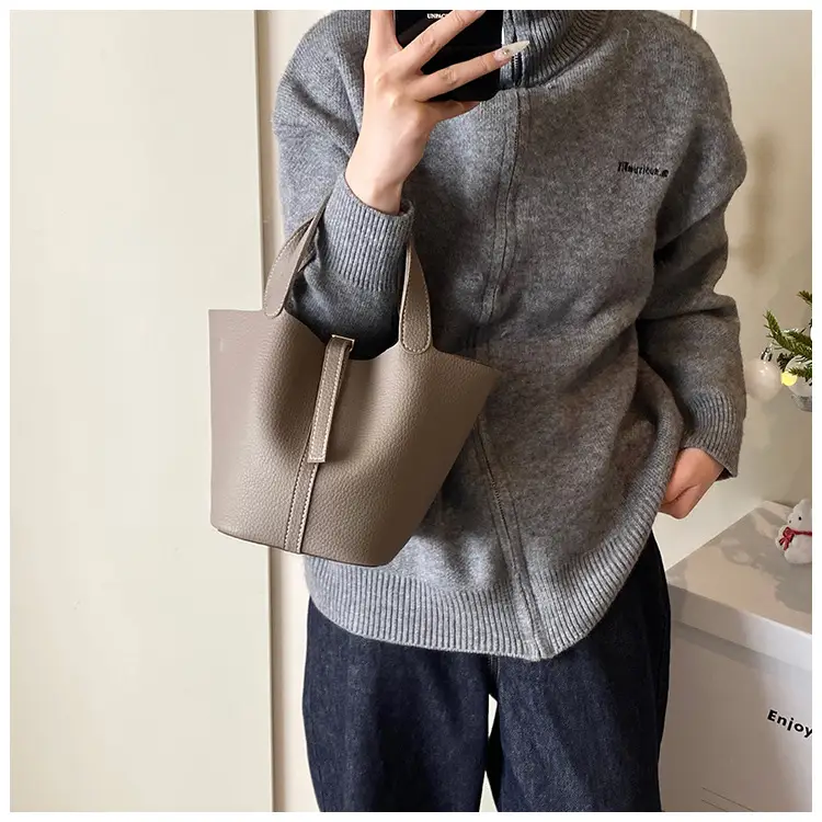 Stylish Brown Leather Handbag with Logo Print — feature 4