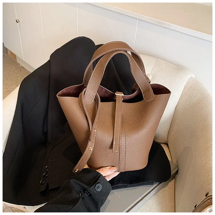 Stylish Brown Leather Handbag with Logo Print — feature 8