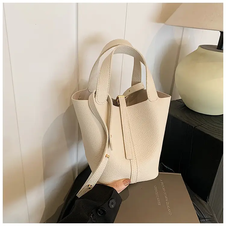 Stylish Brown Leather Handbag with Logo Print — feature 9