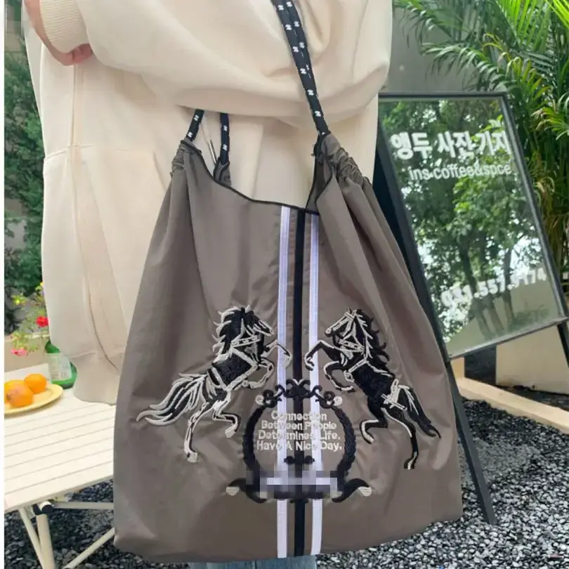 Women Embroidered Crossbody Bag with Ballchain Design - Image 21