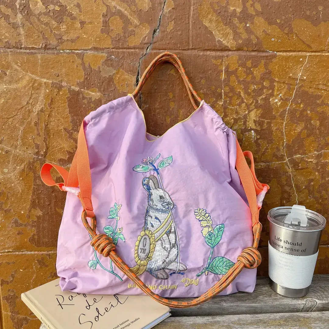 Women Embroidered Crossbody Bag with Ballchain Design - Image 32
