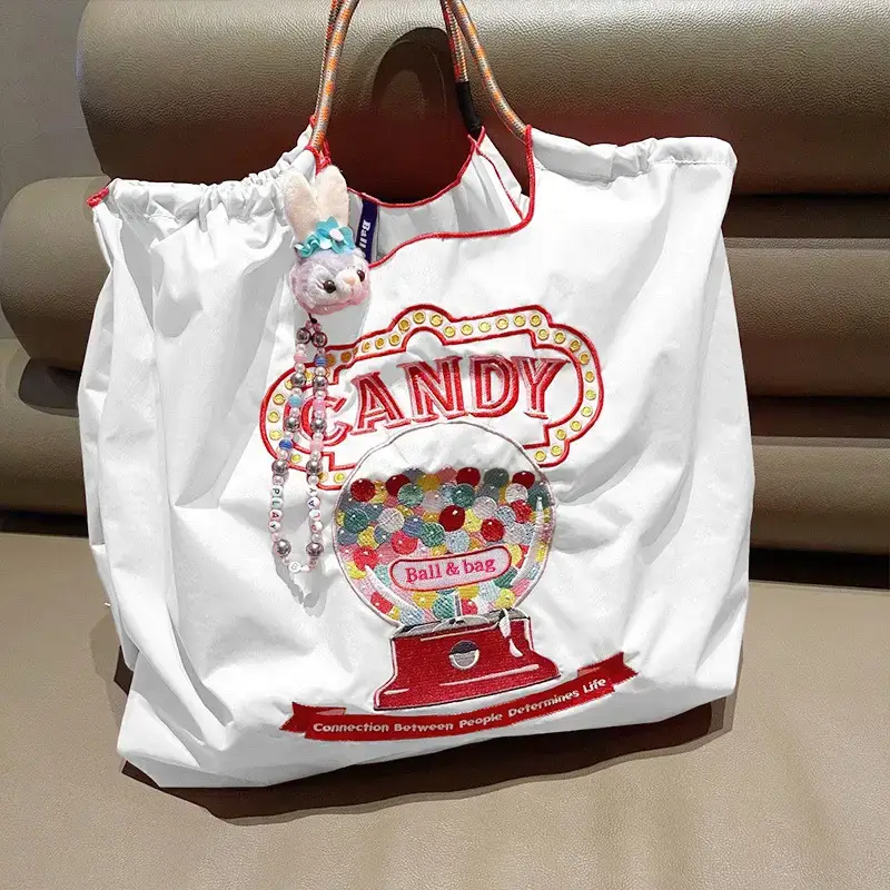 Women Embroidered Crossbody Bag with Ballchain Design - Image 50