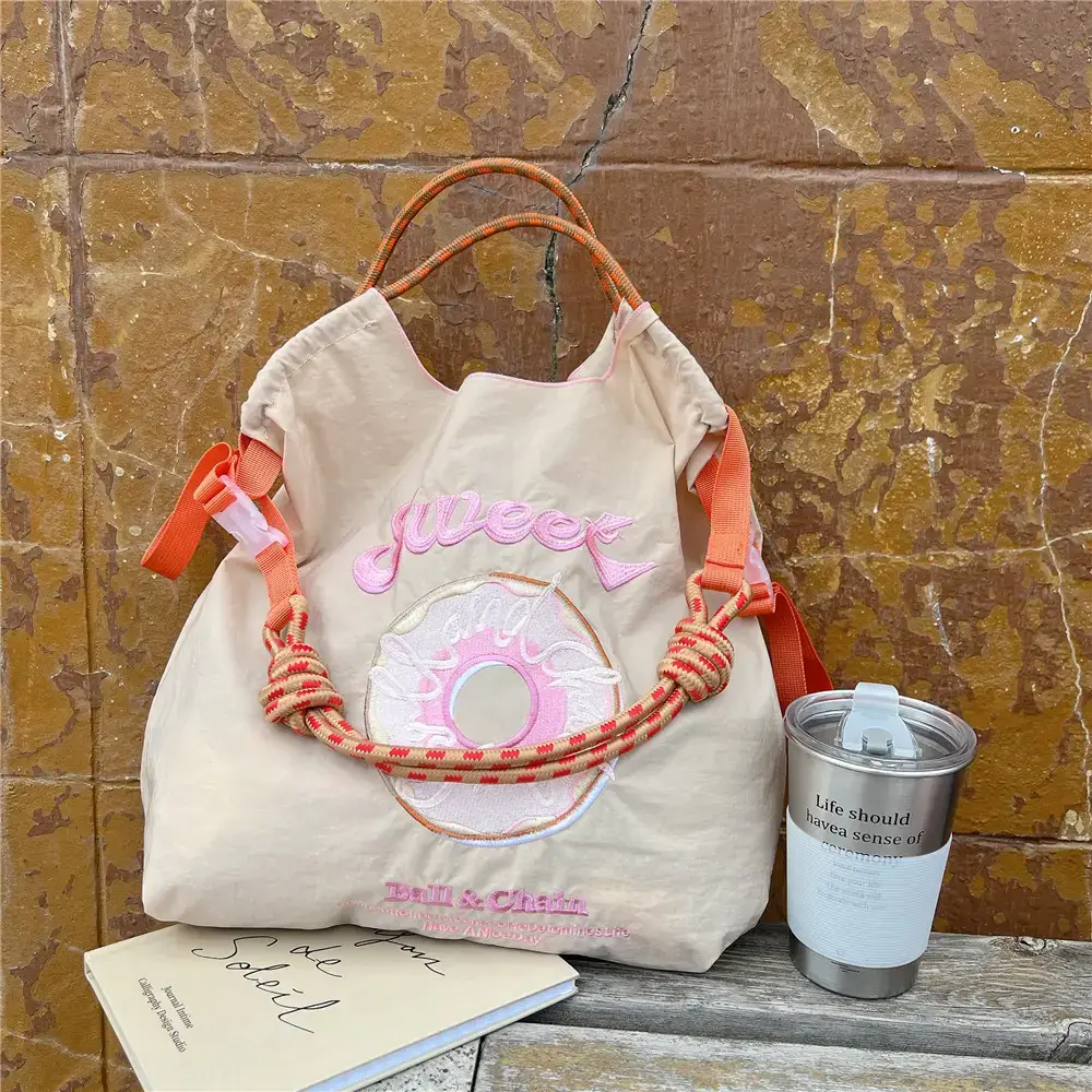 Women Embroidered Crossbody Bag with Ballchain Design - Image 53