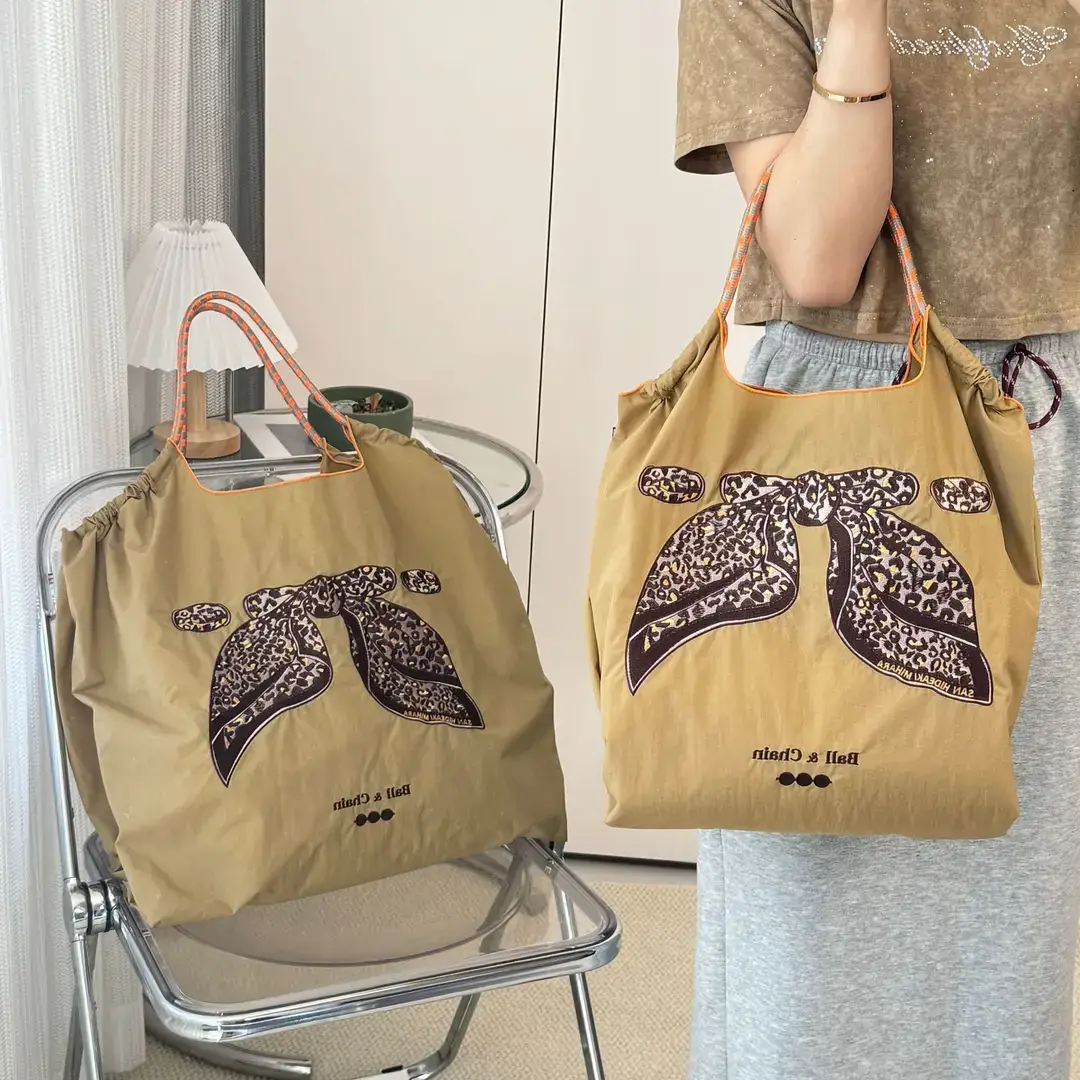 Women Embroidered Crossbody Bag with Ballchain Design - Image 96