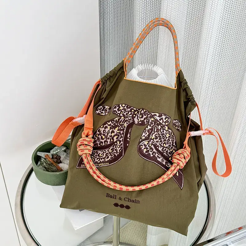 Women Embroidered Crossbody Bag with Ballchain Design - Image 97