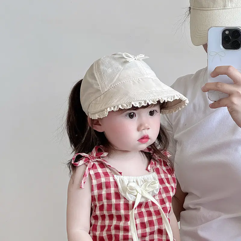 Baby's Brown Bow Cap with Pom Pom Edge — feature 1