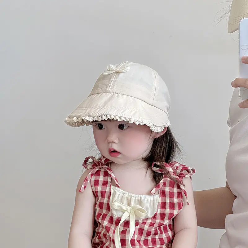 Baby's Brown Bow Cap with Pom Pom Edge — feature 2