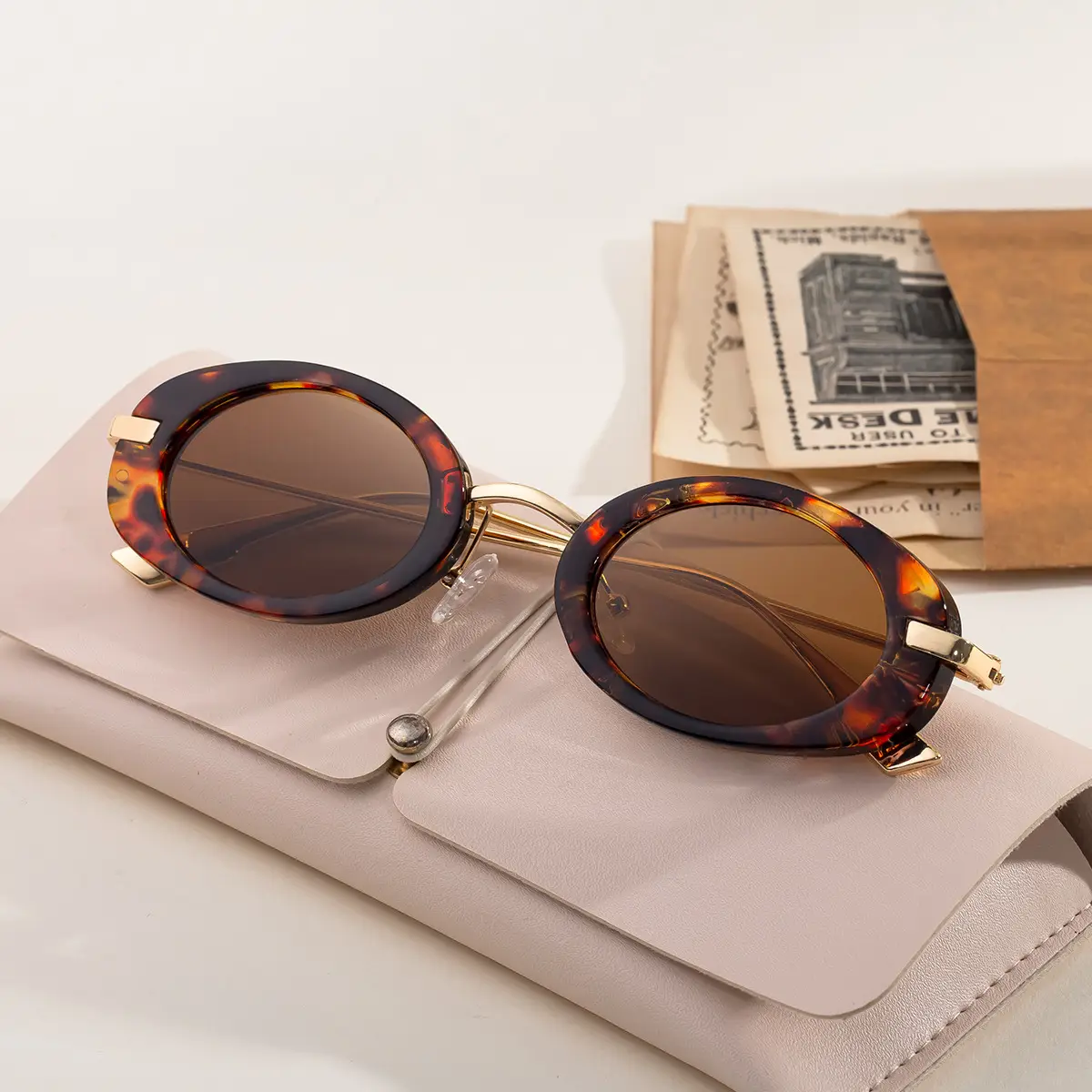 Women's Black Oval Sunglasses with Gold Frame - Image 6