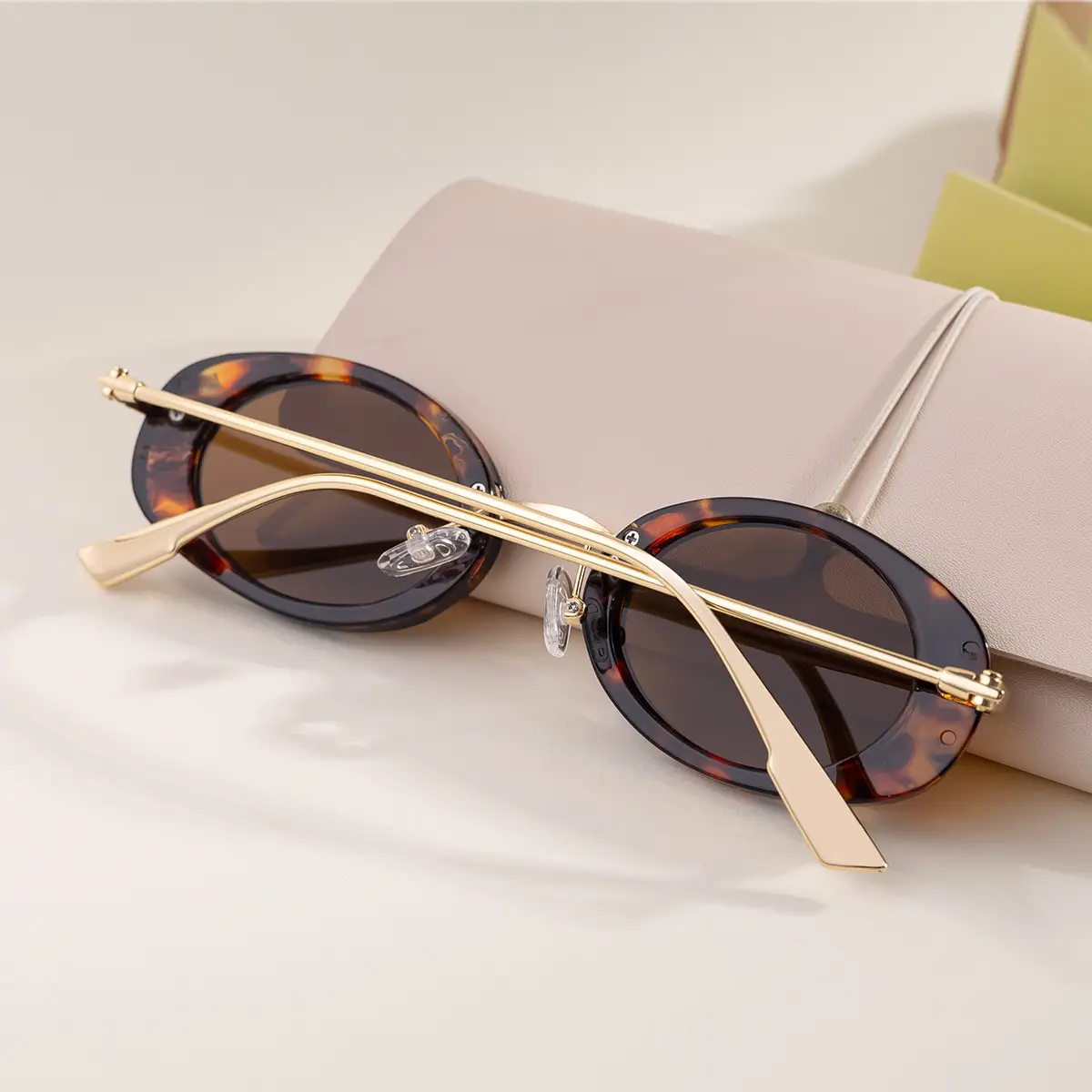 Women's Black Oval Sunglasses with Gold Frame — feature 13
