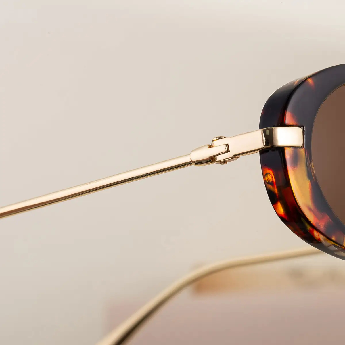 Women's Black Oval Sunglasses with Gold Frame — feature 14