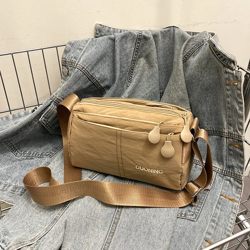 Women's Tan Crossbody Bag with Embellished Tassels - Image 3