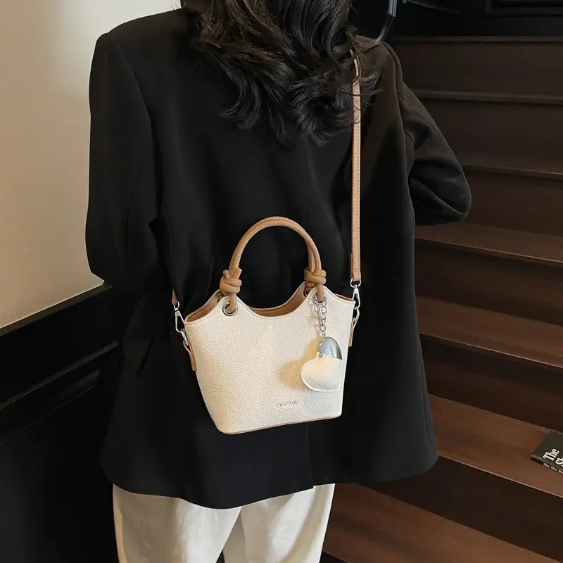 Women's Textured Crossbody Bag with Heart Charm