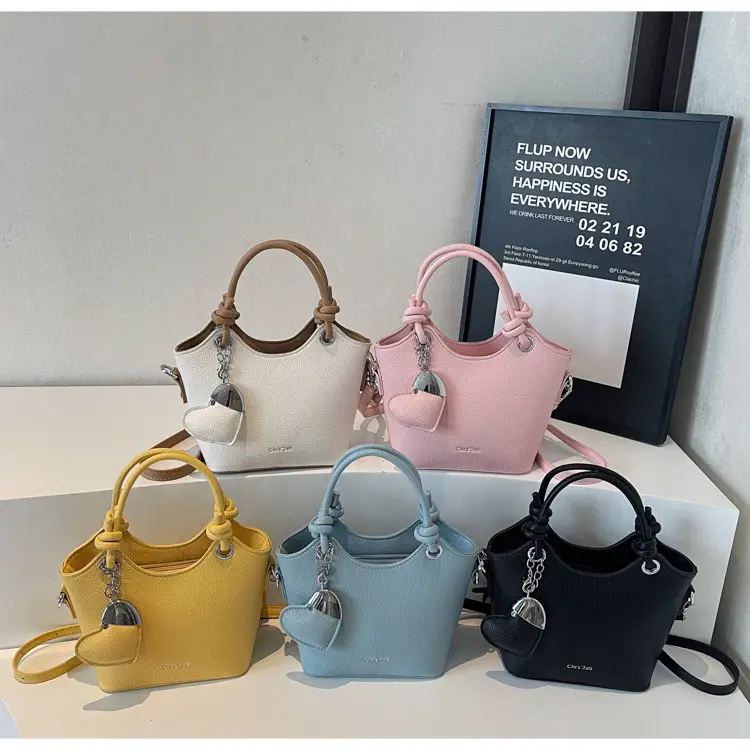 Women's Textured Crossbody Bag with Heart Charm — feature 17