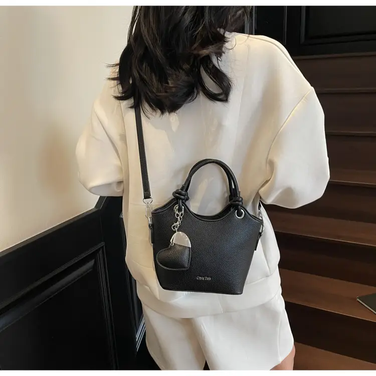 Women's Textured Crossbody Bag with Heart Charm — feature 18