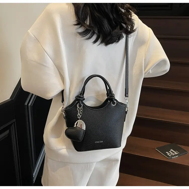 Women's Textured Crossbody Bag with Heart Charm — feature 19