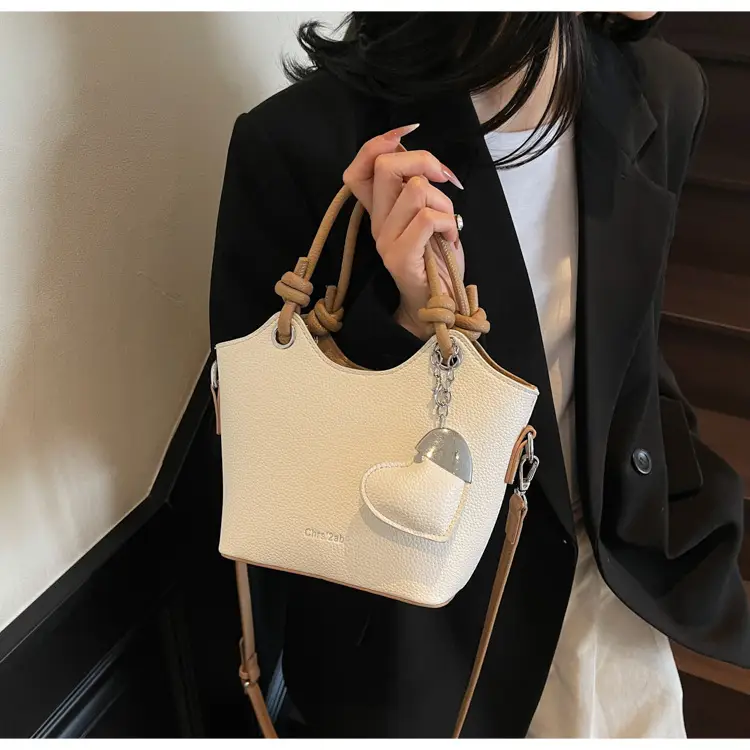 Women's Textured Crossbody Bag with Heart Charm — feature 21
