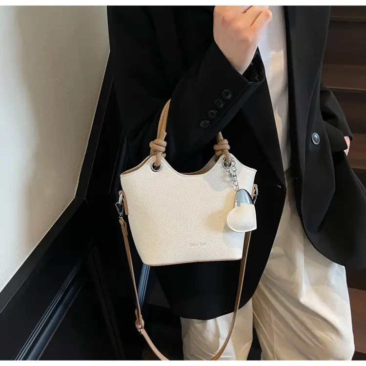 Women's Textured Crossbody Bag with Heart Charm — feature 22