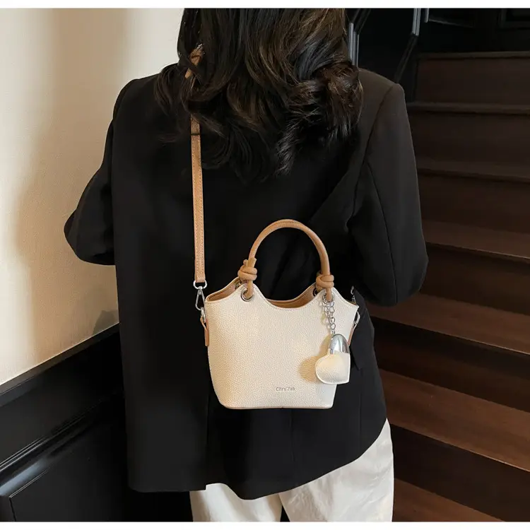 Women's Textured Crossbody Bag with Heart Charm — feature 23