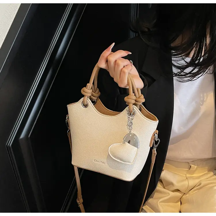 Women's Textured Crossbody Bag with Heart Charm — feature 26