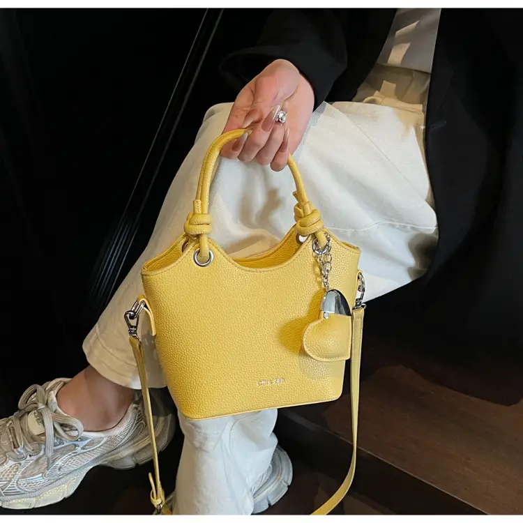 Women's Textured Crossbody Bag with Heart Charm — feature 27