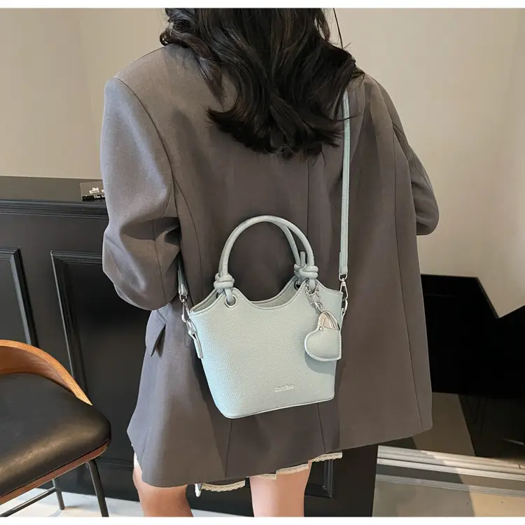 Women's Textured Crossbody Bag with Heart Charm — feature 38
