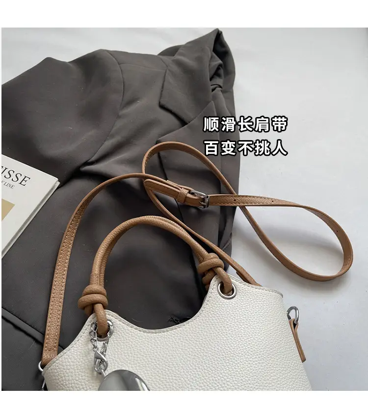 Women's Textured Crossbody Bag with Heart Charm — feature 4