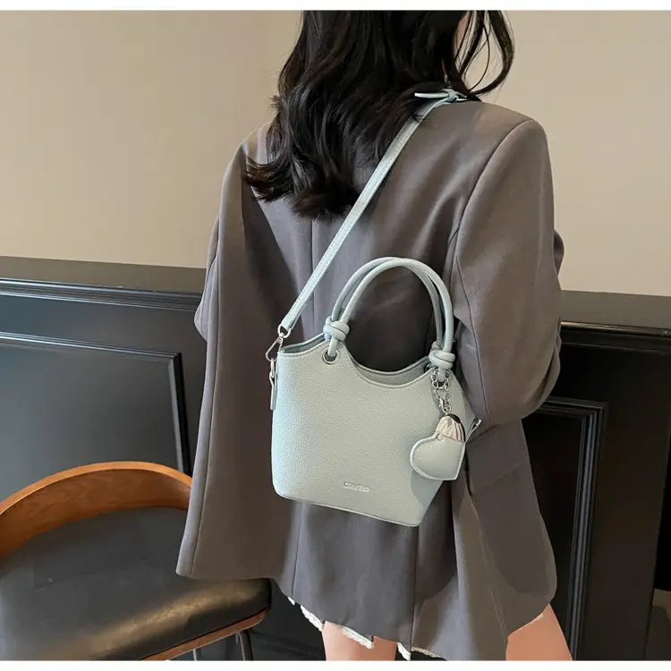 Women's Textured Crossbody Bag with Heart Charm — feature 42