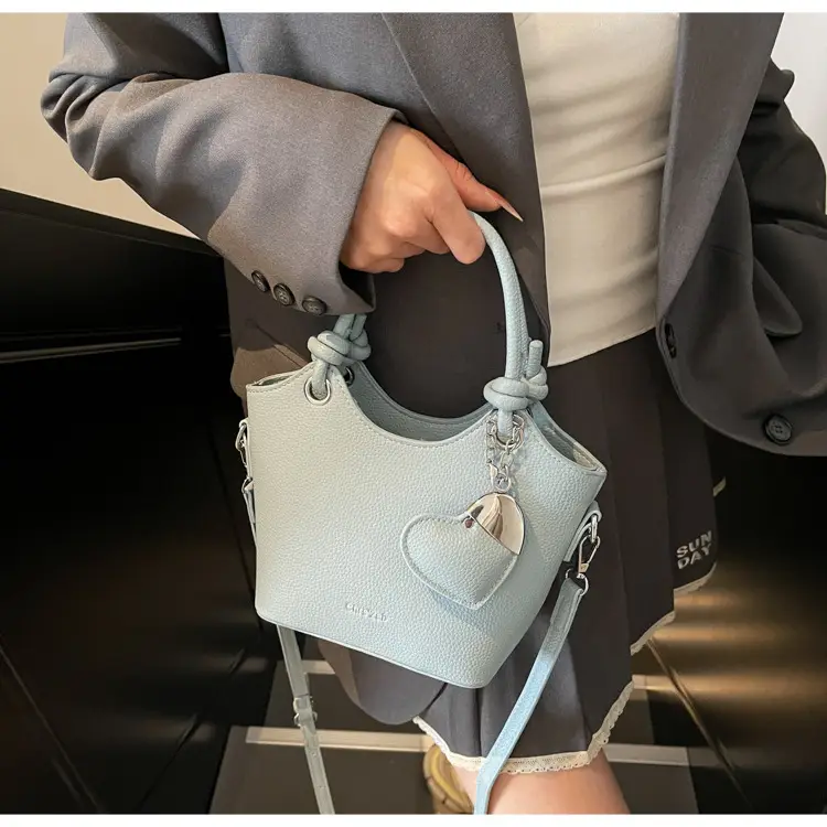 Women's Textured Crossbody Bag with Heart Charm — feature 43