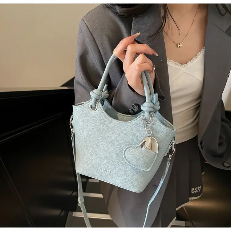 Women's Textured Crossbody Bag with Heart Charm — feature 44