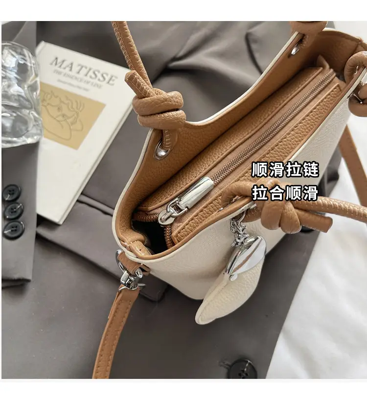 Women's Textured Crossbody Bag with Heart Charm — feature 6
