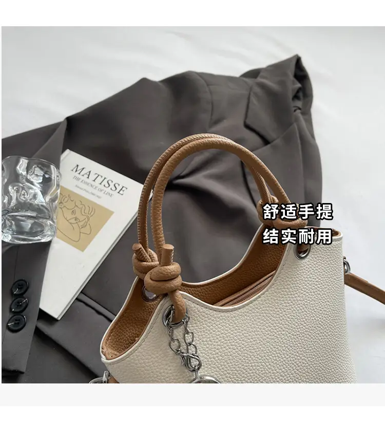 Women's Textured Crossbody Bag with Heart Charm — feature 7