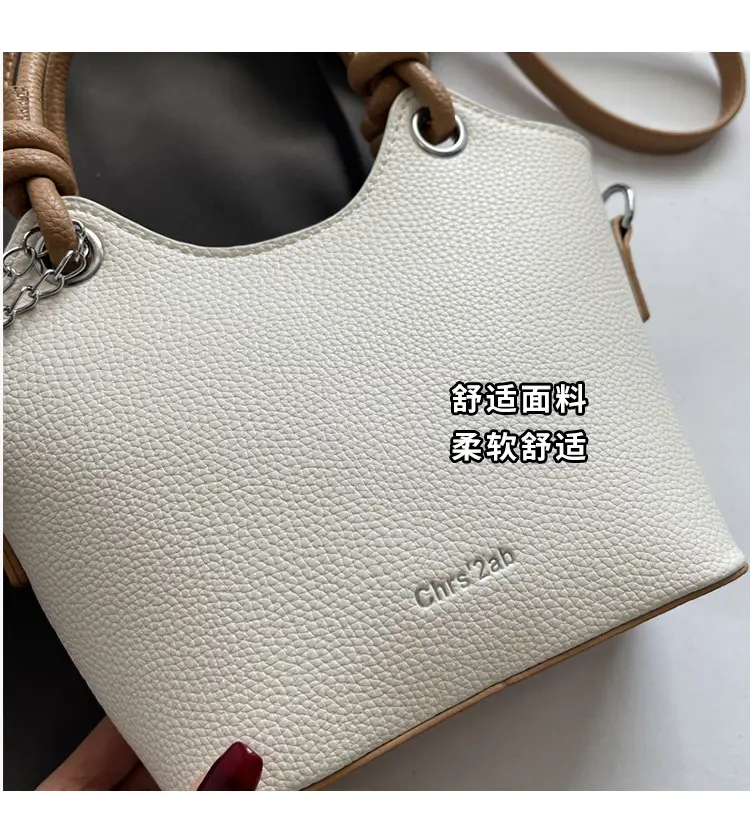 Women's Textured Crossbody Bag with Heart Charm — feature 8
