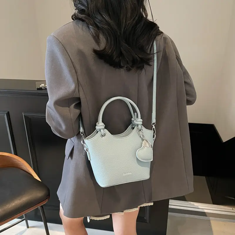 Women's Textured Crossbody Bag with Heart Charm