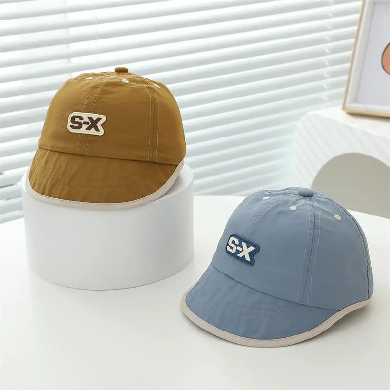 Baby Duck Cap with "SX" Logo Beige Soft Brim Hat