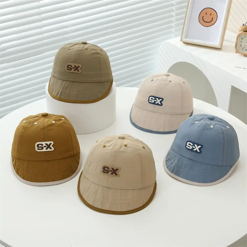 Baby Duck Cap with "SX" Logo Beige Soft Brim Hat — feature 8