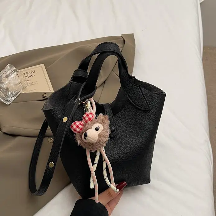 Women's Soft Leather Crossbody Bag with Cute Pom Pom Charm - Image 8
