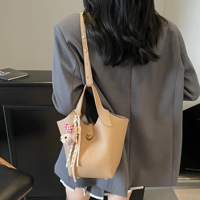 Women's Soft Leather Crossbody Bag with Cute Pom Pom Charm - Image 9