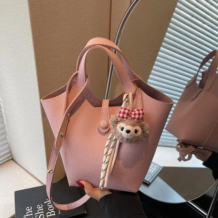 Women's Soft Leather Crossbody Bag with Cute Pom Pom Charm - Image 10