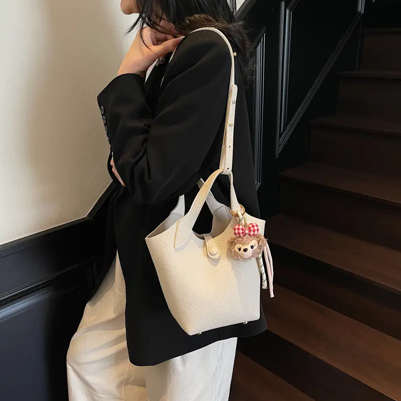 Women's Soft Leather Crossbody Bag with Cute Pom Pom Charm - Image 2