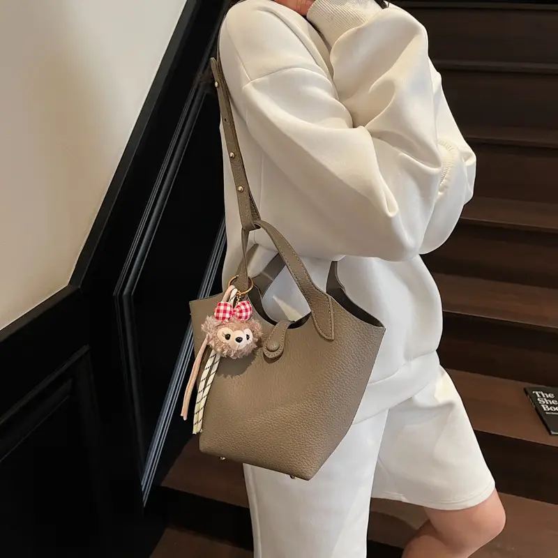Women's Soft Leather Crossbody Bag with Cute Pom Pom Charm - Image 3