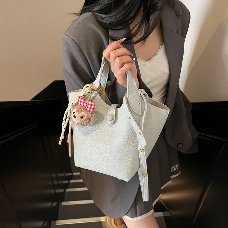 Women's Soft Leather Crossbody Bag with Cute Pom Pom Charm - Image 4
