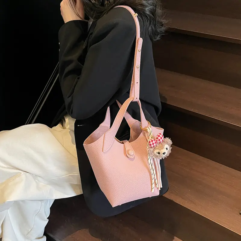 Women's Soft Leather Crossbody Bag with Cute Pom Pom Charm - Image 5