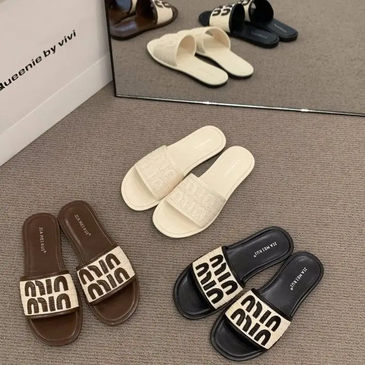 Women's Black Leather Flip Flops with White Stripes 2024