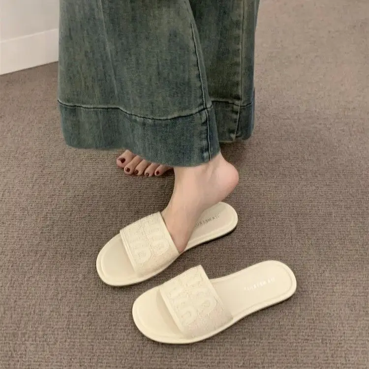 Women's Black Leather Flip Flops with White Stripes 2024