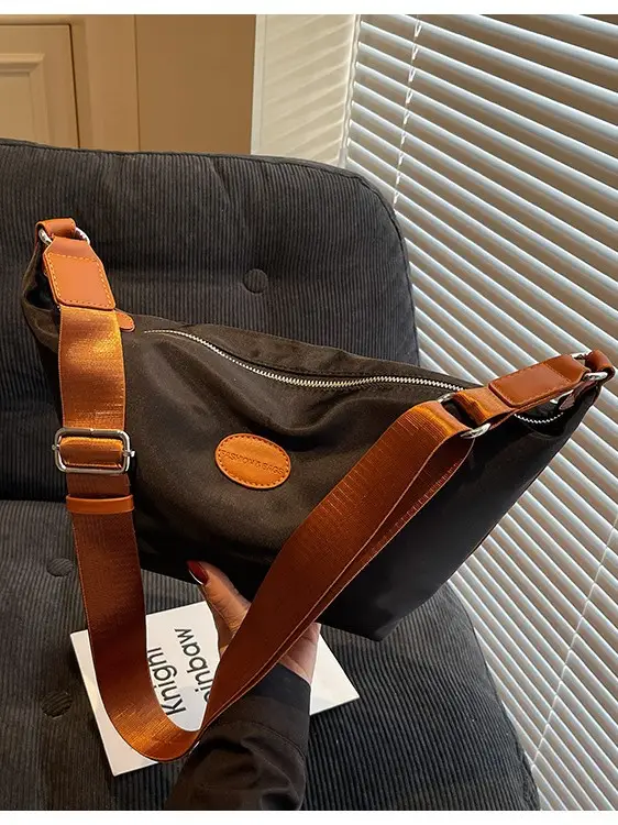 Green Crossbody Bag with Orange Handle & Leather Strap