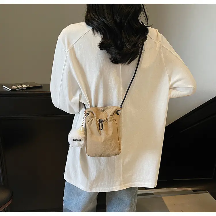 Lightweight Women's Drawstring Bag with Pom Pom Charm — feature 18