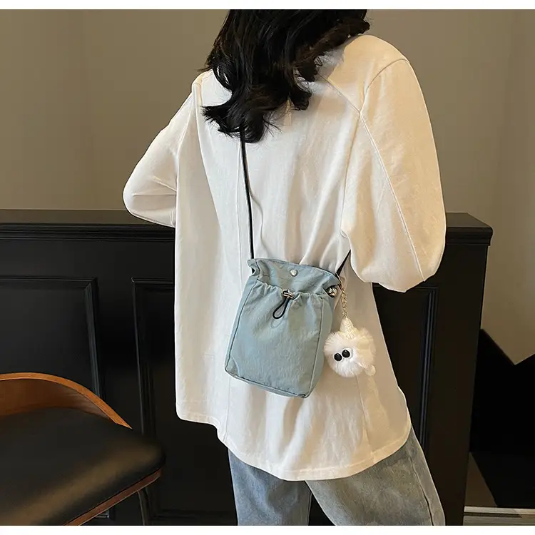 Lightweight Women's Drawstring Bag with Pom Pom Charm — feature 21