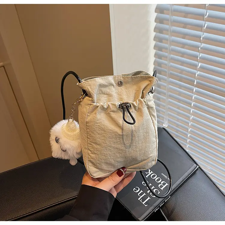 Lightweight Women's Drawstring Bag with Pom Pom Charm — feature 31