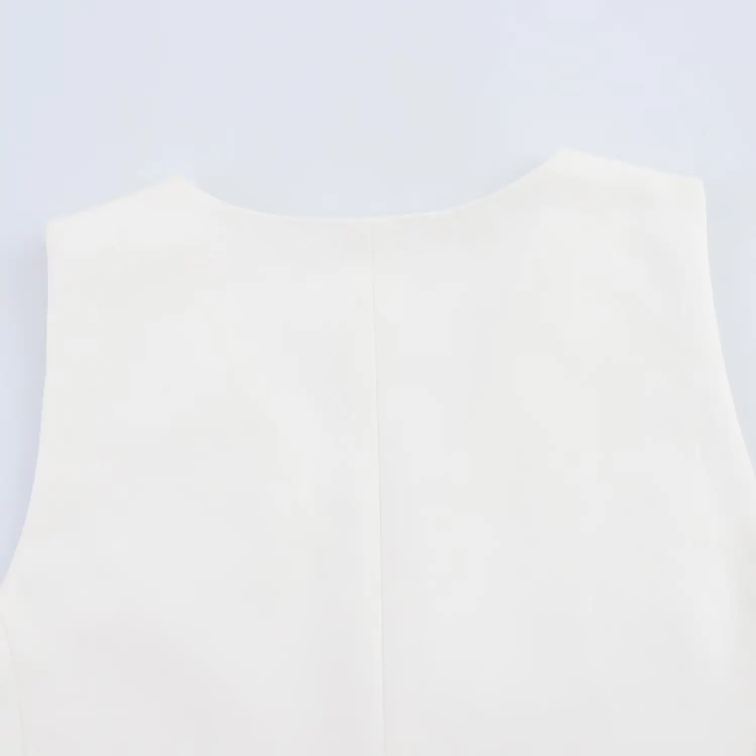 White Sleeveless Vest with Belted Pleated Pants — feature 11
