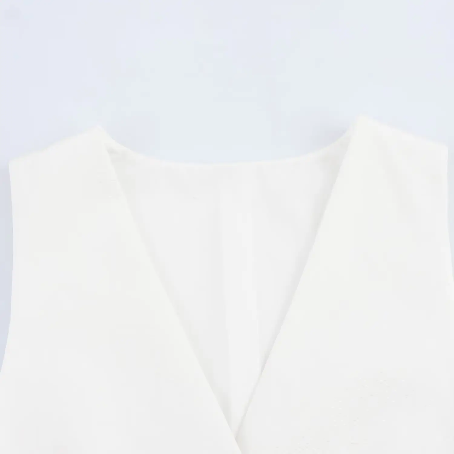 White Sleeveless Vest with Belted Pleated Pants — feature 6
